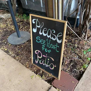 a sign that reads please, see it at the patio