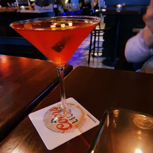 a martini on a coaster