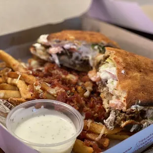 Steak and Cheese wedge placed aside the bacon cheese fries. The presentation looks better this way! ;).  BOTH VERY GOOD!