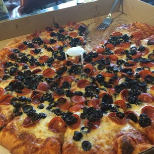 a pepperoni and olive pizza