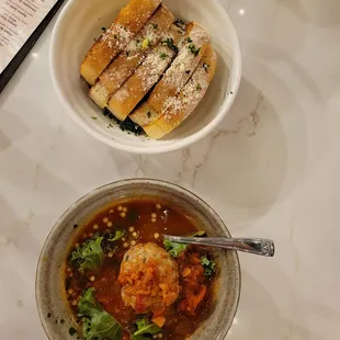 a bowl of soup and bread
