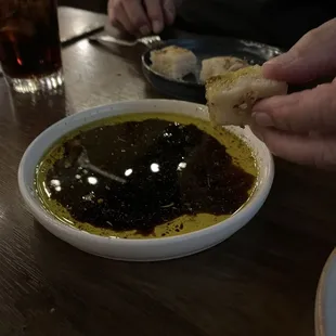 Oil and vinegar (with spices) to dip our bread