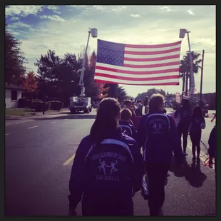 Team dancers walking in the Elk Grove Veteran&apos;s Day Parade