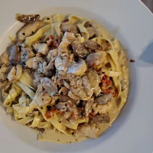 Main St. Pasta Fettuccine with Grilled Chicken, Italian Sausage, Mushrooms, Sun-Dried Tomatoes, in a Black Pepper Cream Sauce