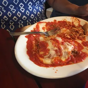 a plate of spaghetti and meat