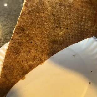 Basic very dry crust. They use screens to bake them. According to most, this is an amateur move.