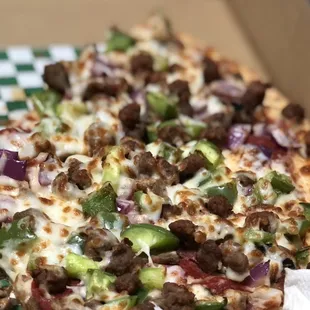 a close up of a pizza in a box