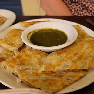 Bolani: thin, crispy dough w spicy potato and leek filling.  So hot and tasty.
