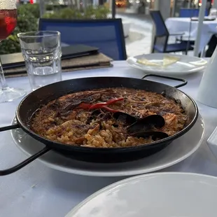 Burnt paella. Owner chose to charge us 50% off for this sad looking paella meal.  He should have removed the charge from our restaurant.