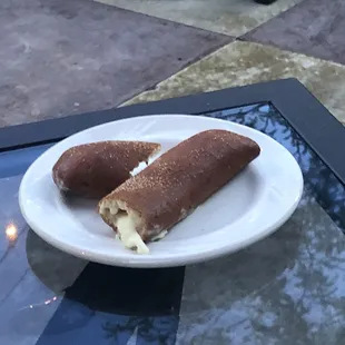 Supposed to be some type of bread stick with mozzarella inside.