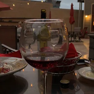 a glass of wine on a table