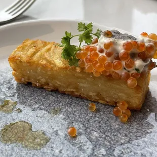 Rosti potato with crème fraiche, truffle and smoke trout roe