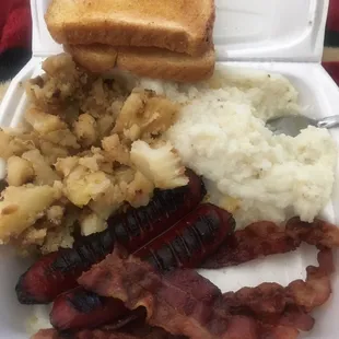 a white styrofoam container filled with food