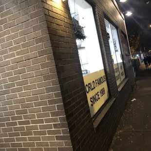 a brick storefront at night