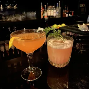 two cocktails on a bar