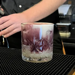 a bartender making a drink