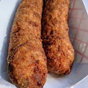 two fried chicken sticks
