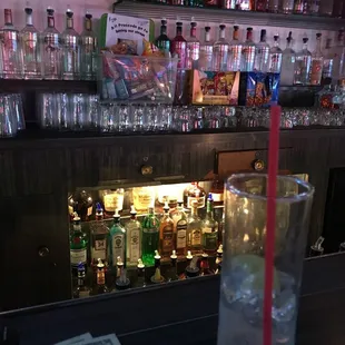 a glass of water with a straw