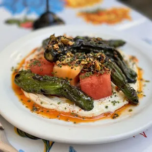 Shishito peppers and melon with yogurt and chili crisp