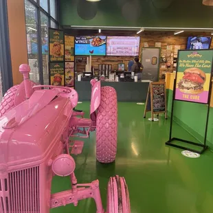 a pink tractor on display