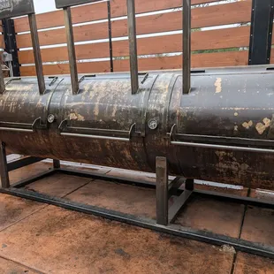 One of the several gigantic smokers behind Belly.
