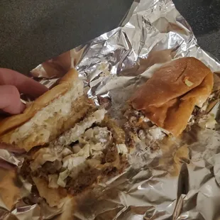 My steak and cheese that they ruined with coleslaw and pickles