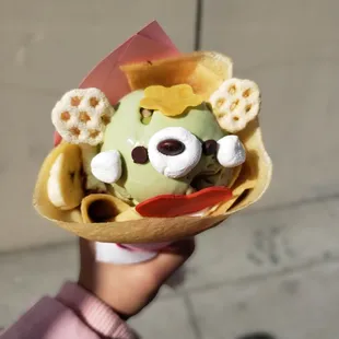 Green tea ice cream crepe wit banana, nutella and whipped cream