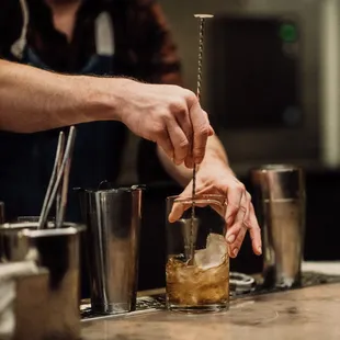 a bartender mixing a drink