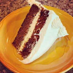 a slice of cake on a yellow plate