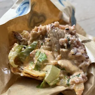 Grilled chicken burrito completely drenched in sauce. Gross.