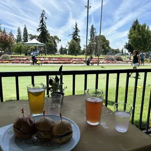 Out door, patio with wagyu sliders, and a couple of cool beverages