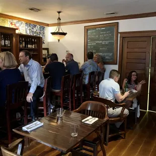 a group of people sitting at a bar