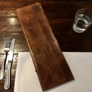 a knife, fork, and glass of water