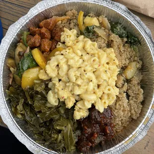 Large portion. Clockwise from top: quinoa, BBQ, collard greens, mushrooms (with squash), sweet &amp; sour, and mac and cheese on top.