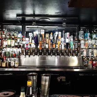 a bar filled with bottles of alcohol