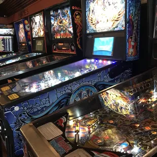 a row of pinball machines