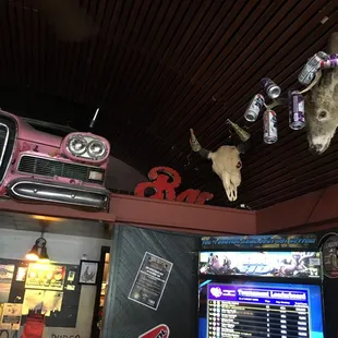 a pink car and a bull head