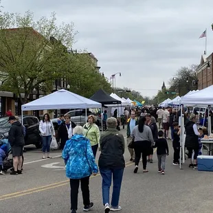  crowd of people walking through the market