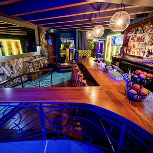 a bar with a long wooden counter