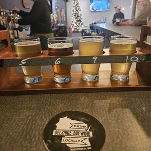 a flight of beer glasses