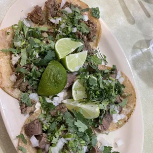 Lengua and carne asada tacos