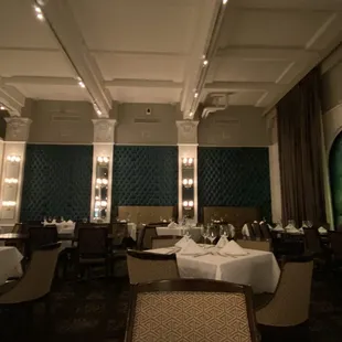 a dining area with tables and chairs