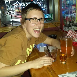 a woman sitting at a bar