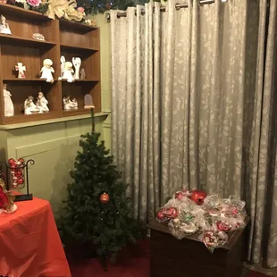 a christmas tree in the corner of the room