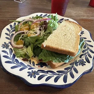 a sandwich and salad on a plate