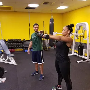 Our trainer Raul helping out his client with form