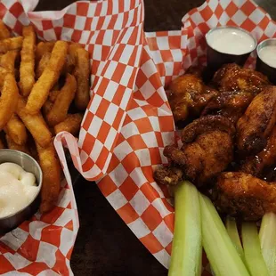 Fries (left) and habanero-mango chicken wings (right)