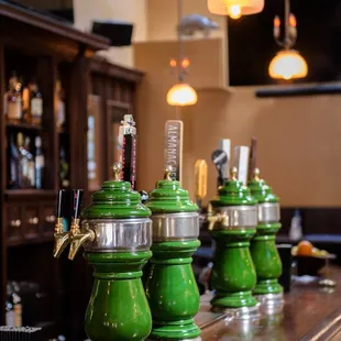  row of green beer taps