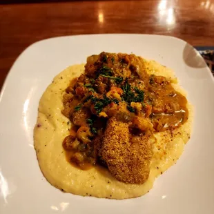 Dejavu Special- Catfish served on a bed of Pimento Cheese Grits and topper with Crawfish Etoufee
