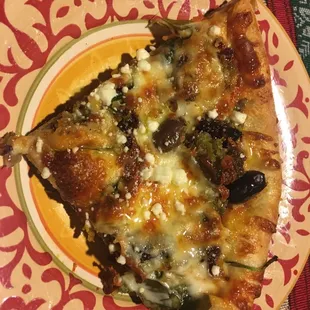 Thin Greek pizza with falafels.